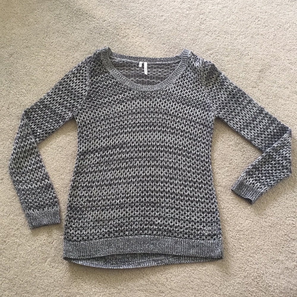 Grey fishnet-like knit sweater.